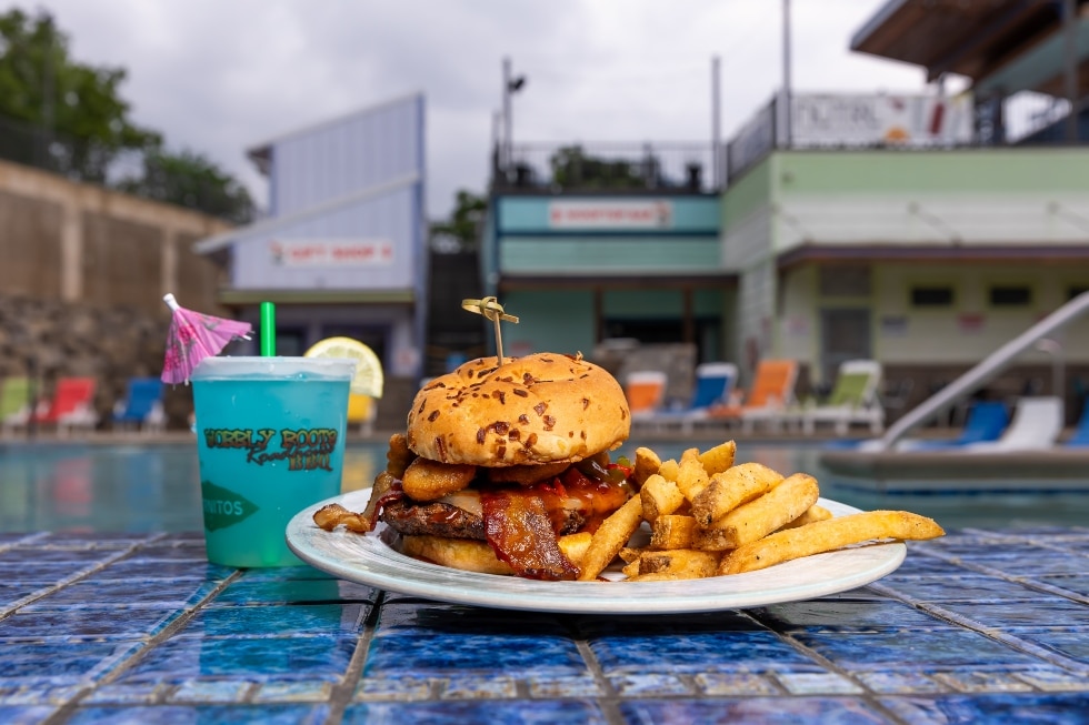 bacon burger with fries and a refreshing adult beverage